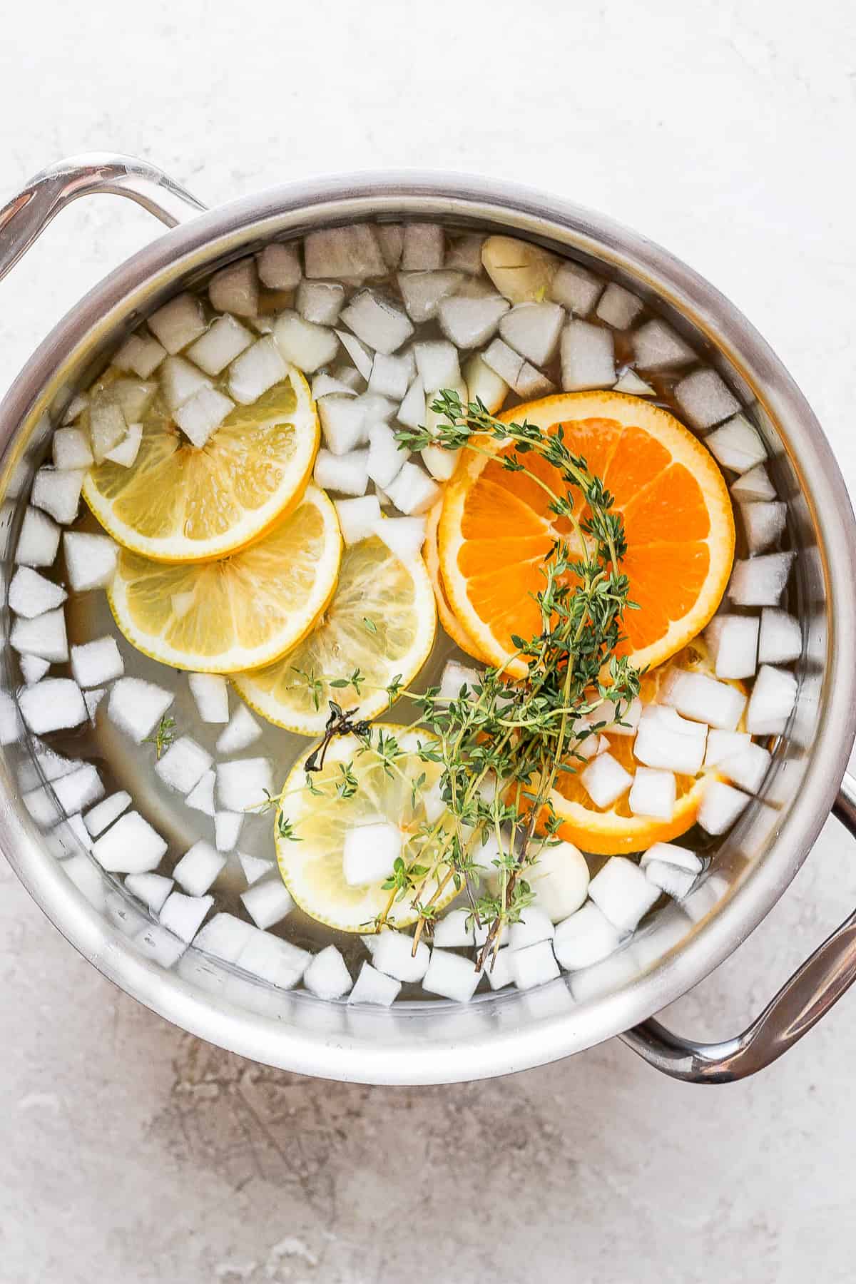 chicken brining in pot.