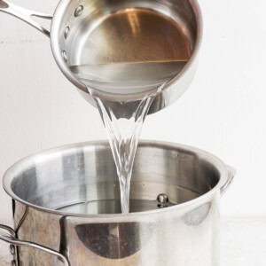 Pouring water into turkey brine.