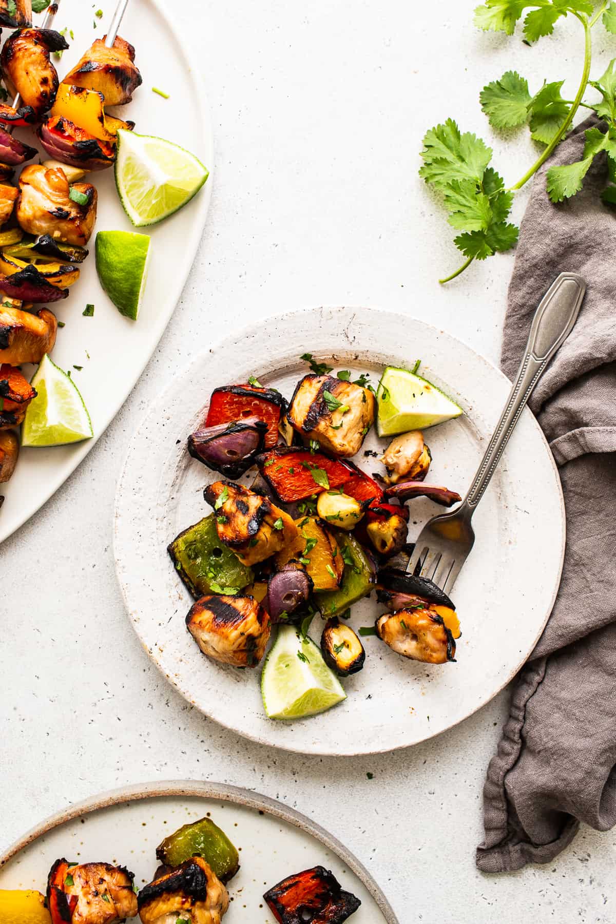 Grilled chicken and veggies on a plate.