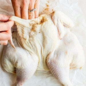 rubbing chicken.