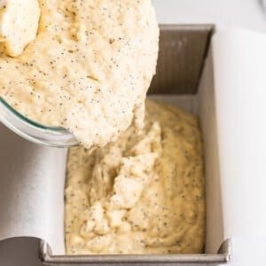 Pour the batter into a lined loaf pan.