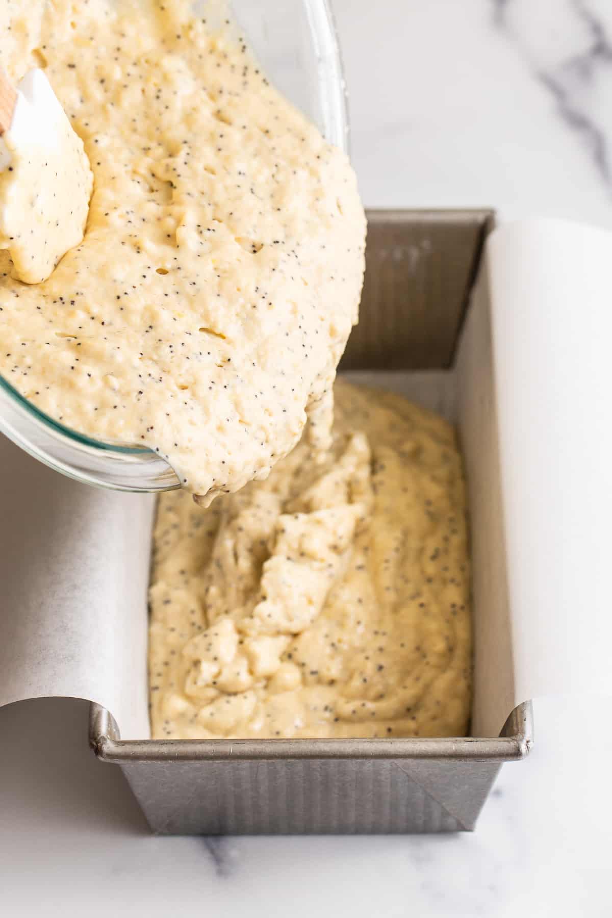 Pour the batter into a lined loaf pan. 