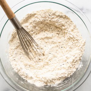 The dry ingredients for lemon poppy seed bread in a bowl.