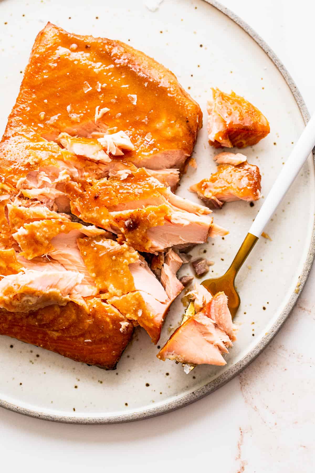 Flaked smoked salmon on a plate. 