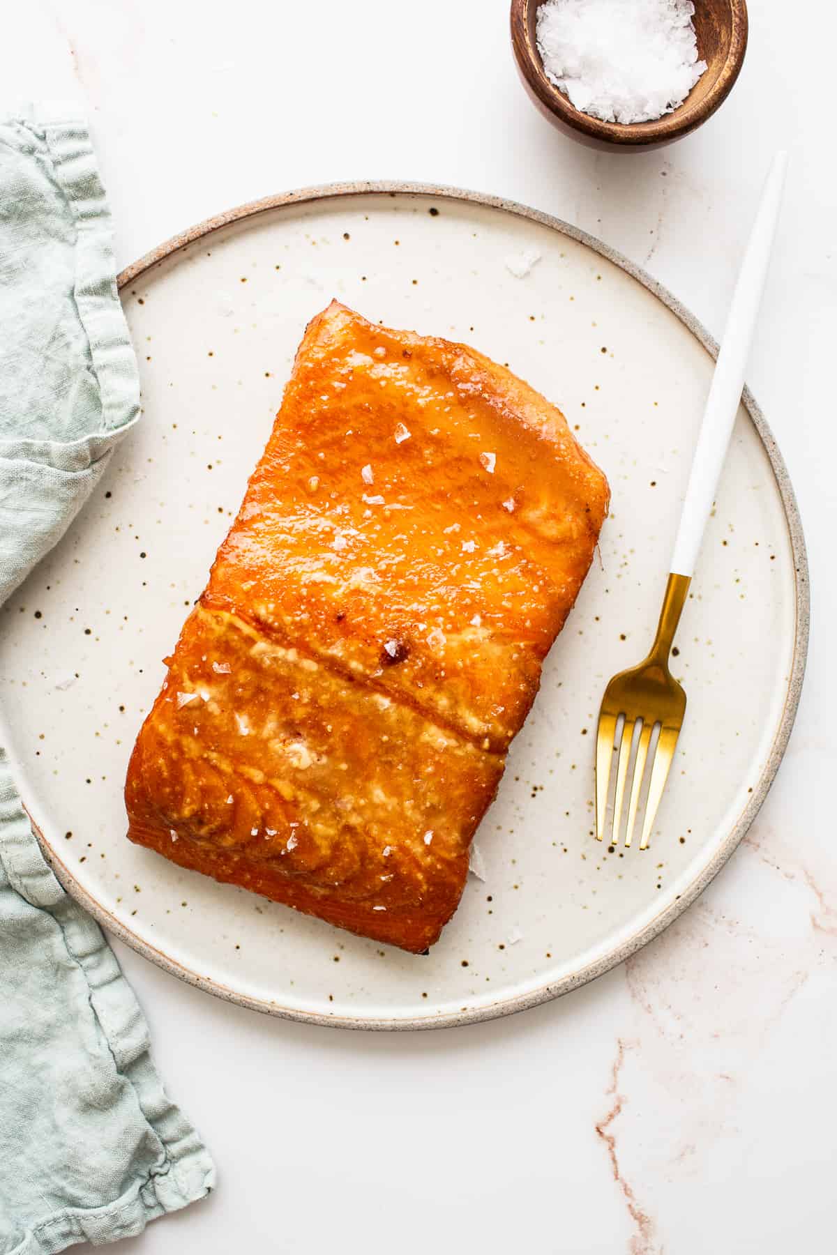 A filet of smoked salmon on a plate. 