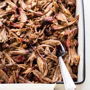 Shredded smoked pork shoulder in a tray.