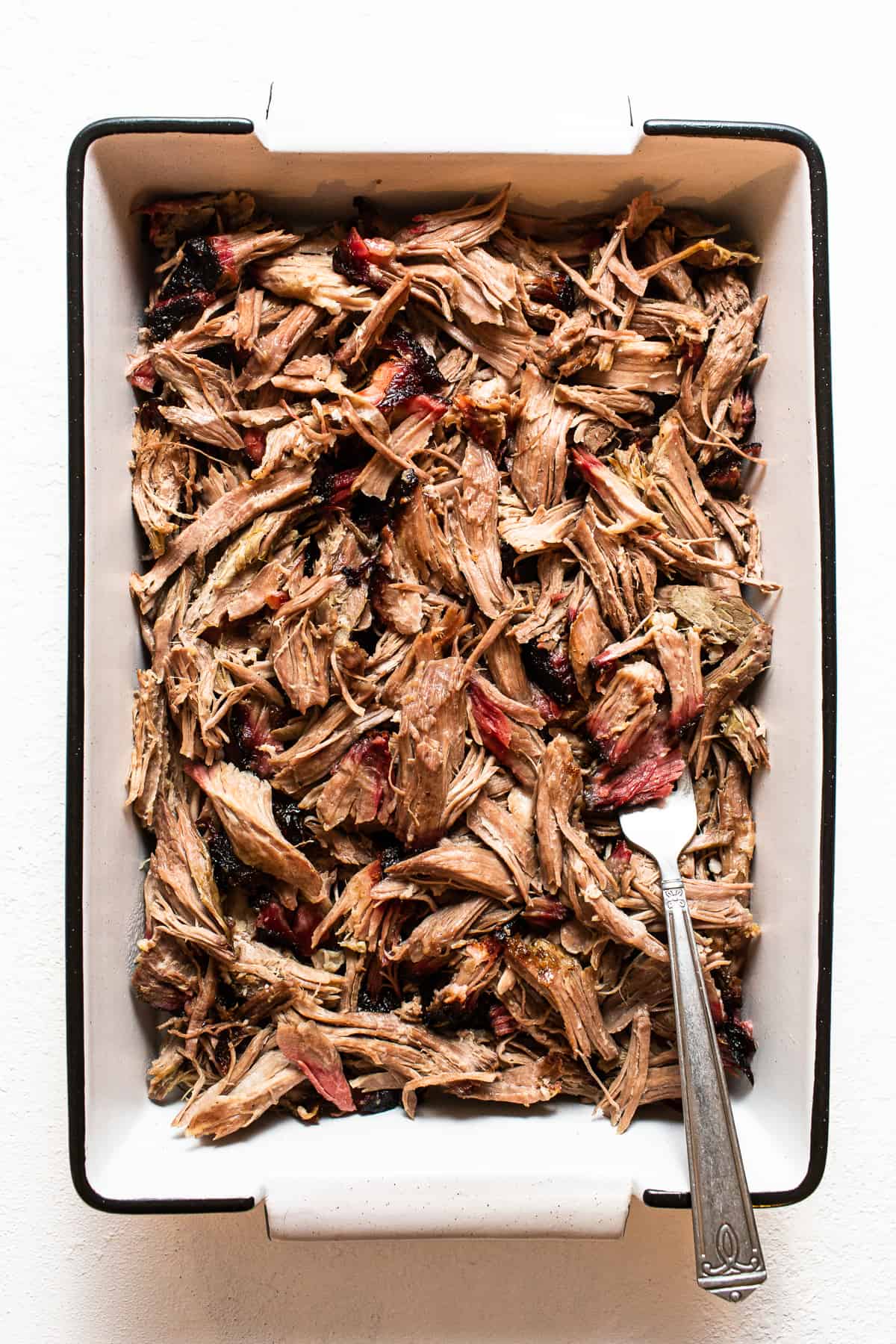 Shredded pork shoulder in a dish. 