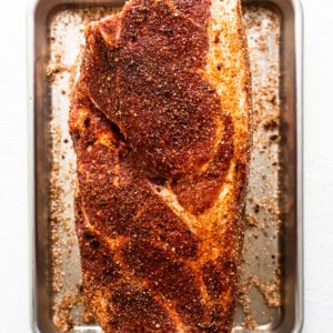 Pork shoulder sprinkled with dry rub.