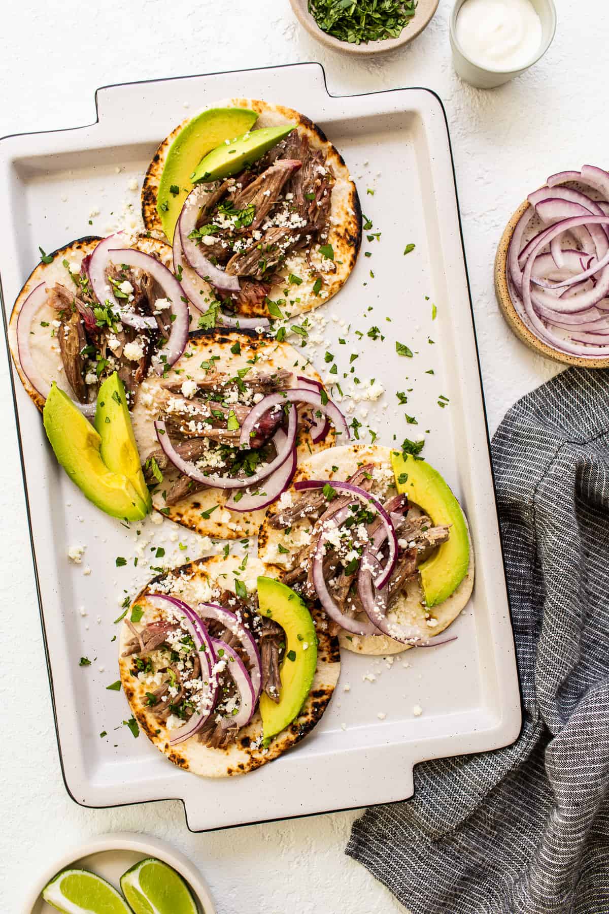 shredded pork tacos with avocado.