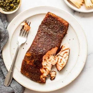 Salmon on plate with fork.