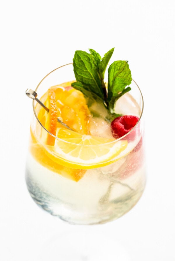 Refreshing white wine spritzer in a wine glass.