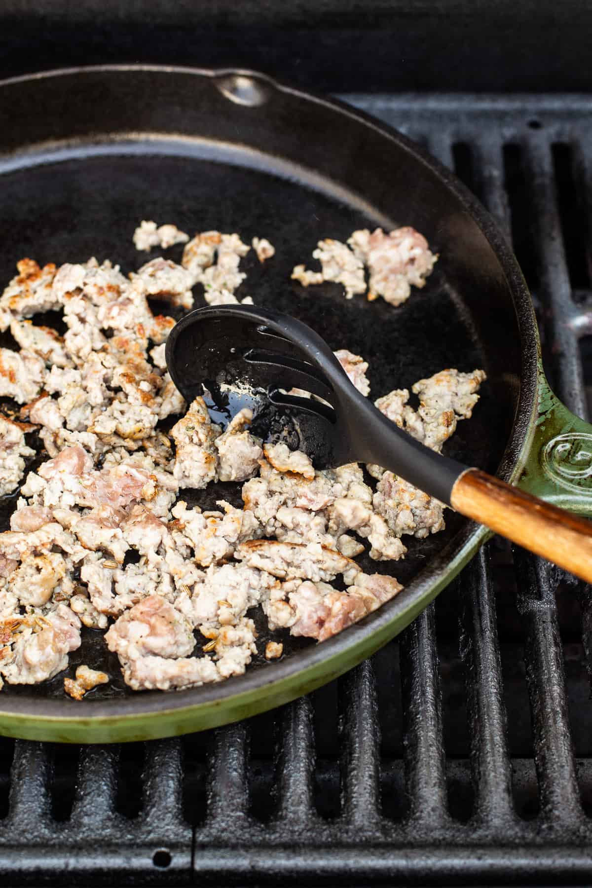 cooking sausage in cast iron.