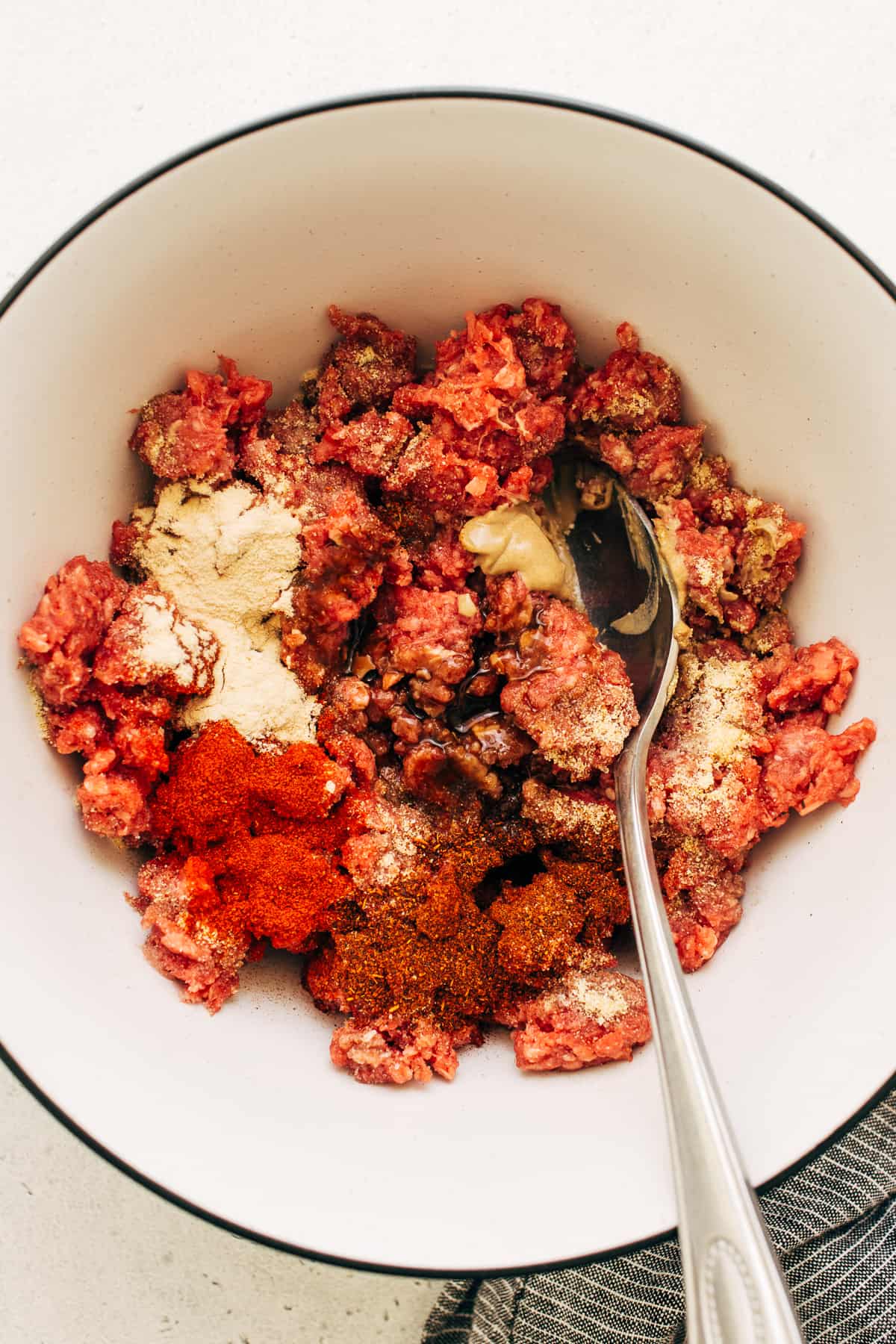 Homemade burger patty ingredients in a bowl.