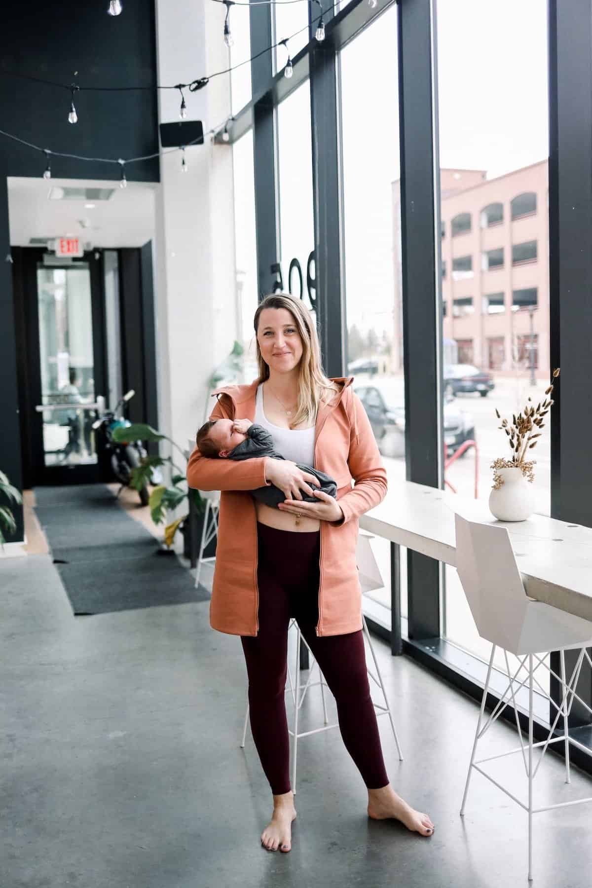 Woman holding a baby.