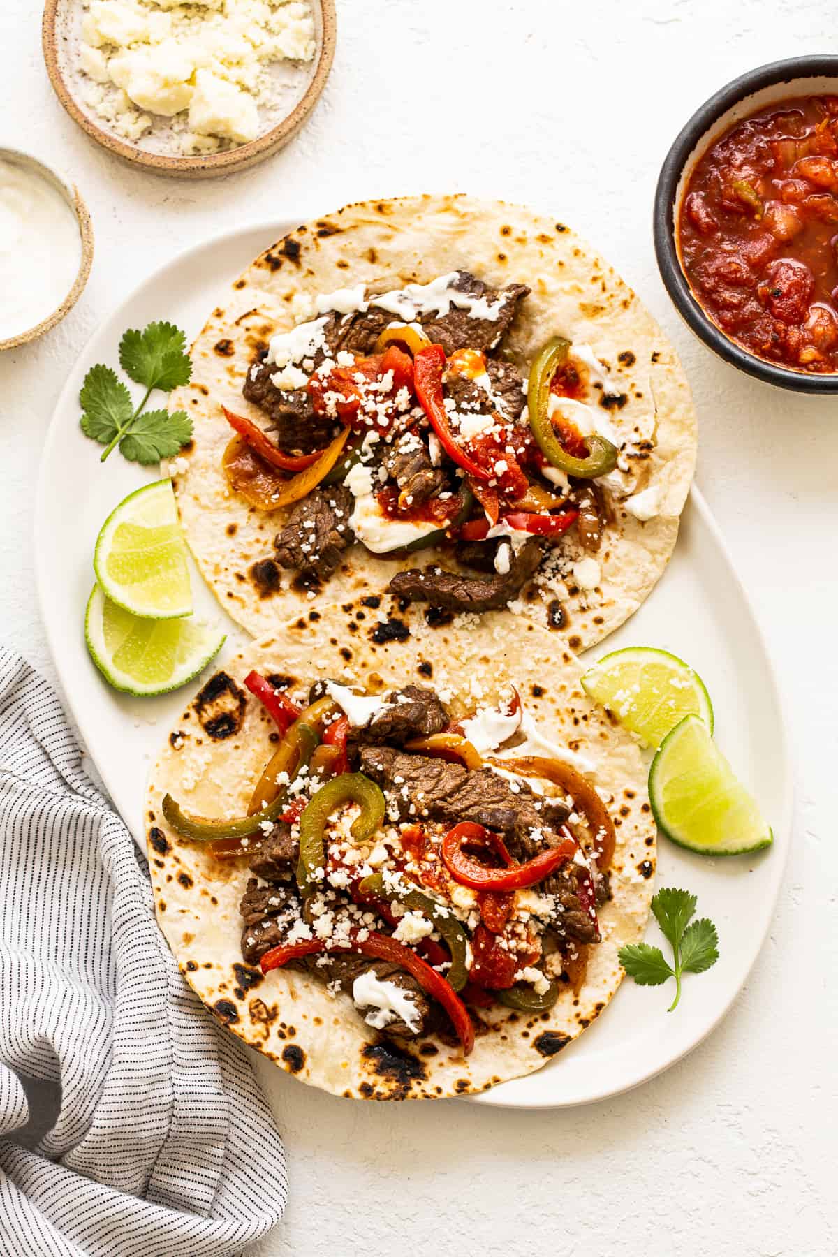 Steak fajitas on a plate.