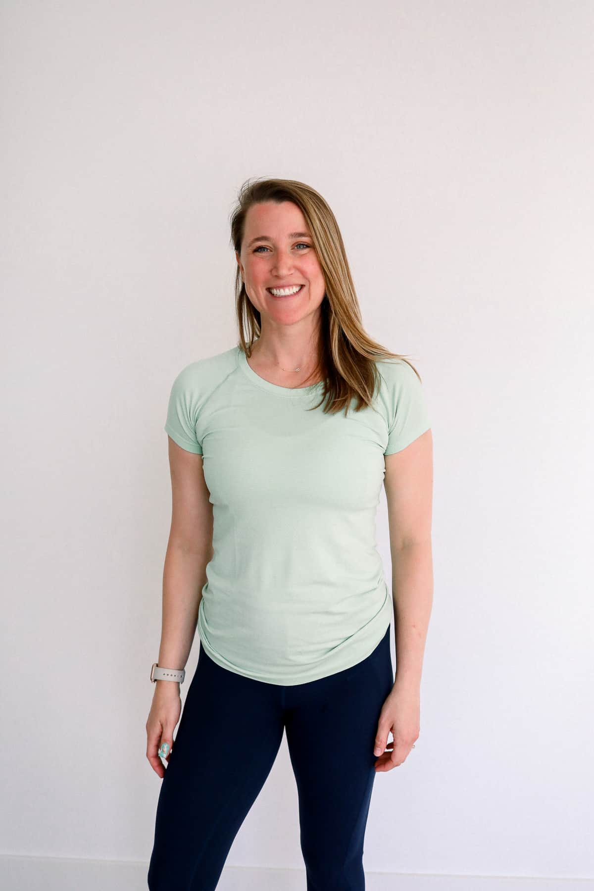 Woman wearing a lululemon short sleeve shirt.