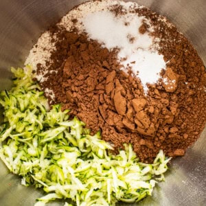 A bowl of ingredients with zucchini and chocolate in it.