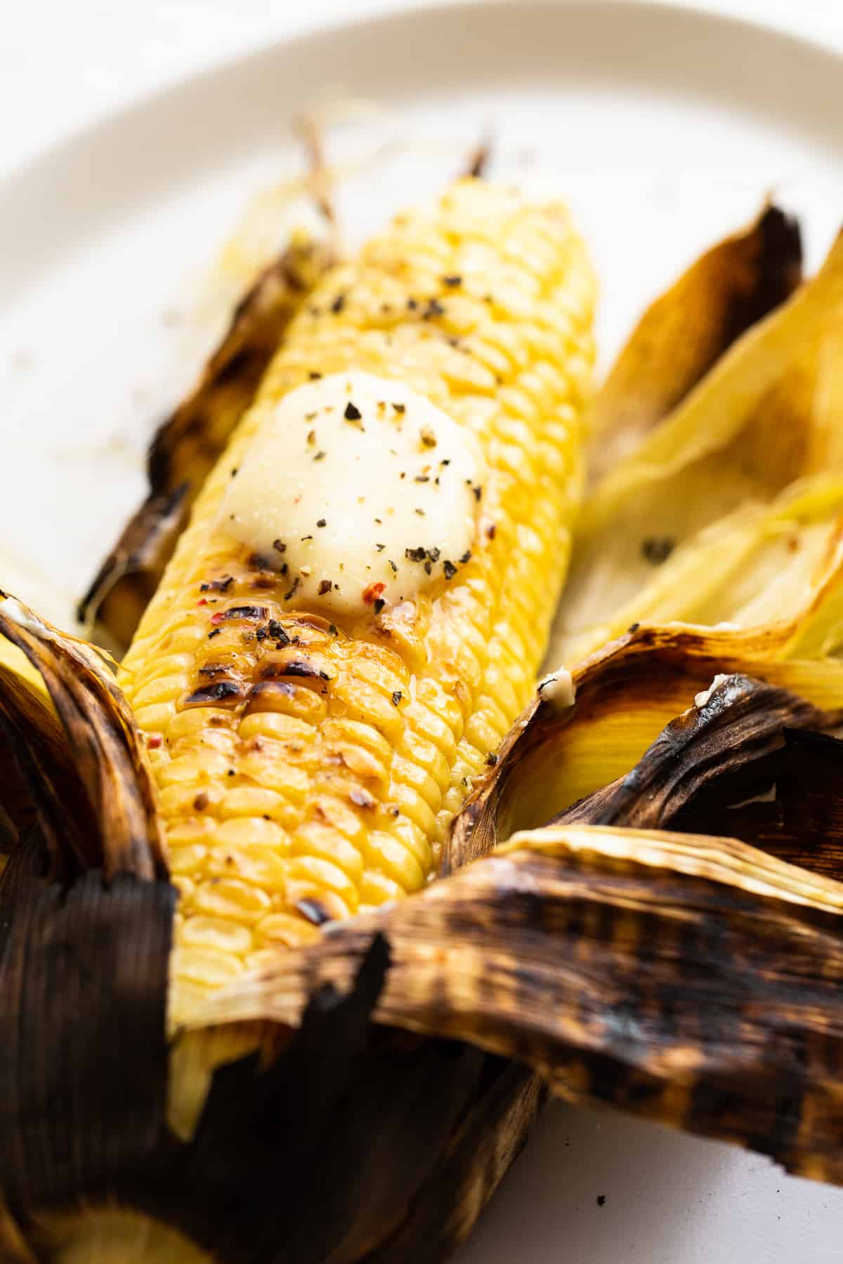 corn on the cob with butter, salt, and pepper.