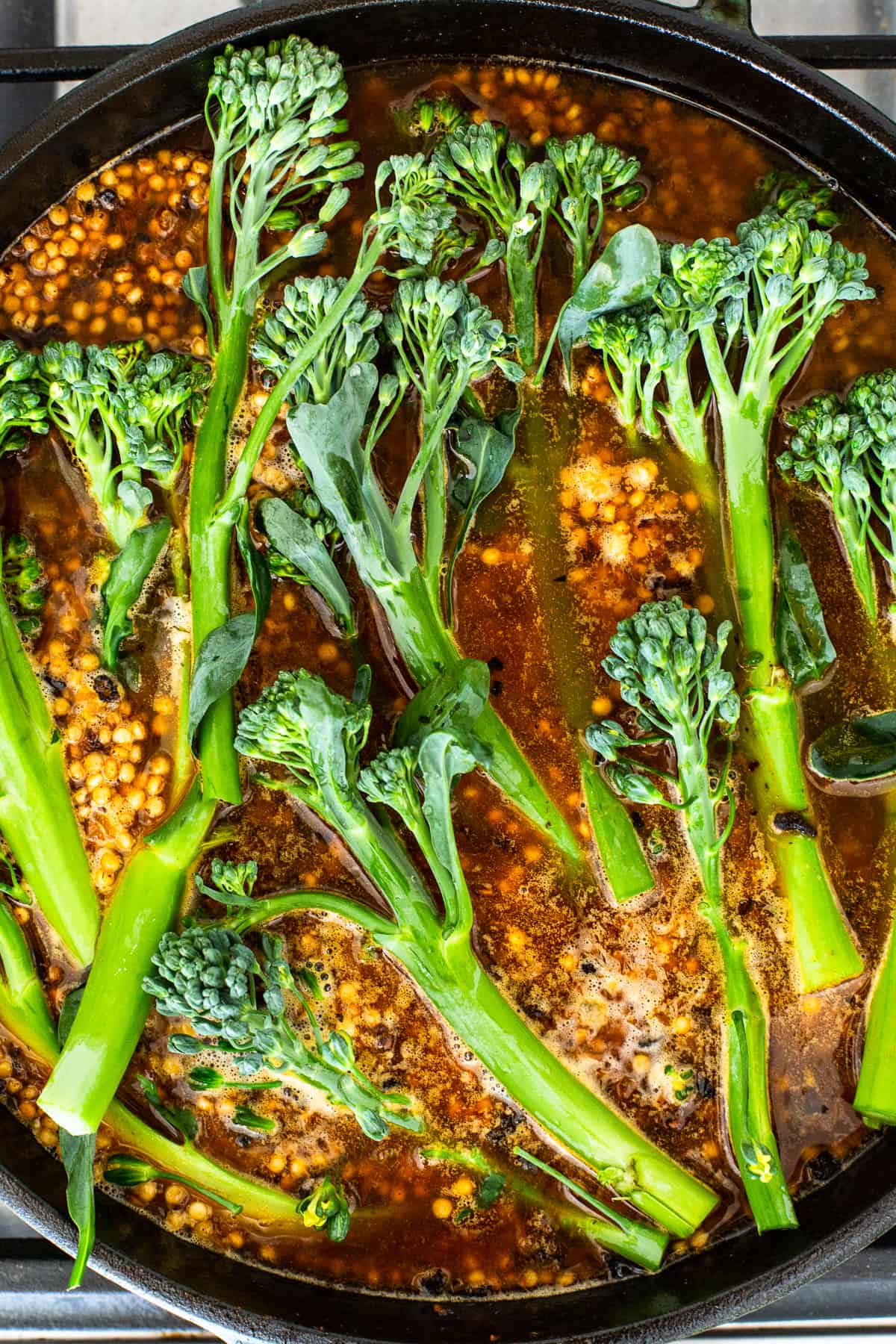 Broccolini in a cast iron skillet.