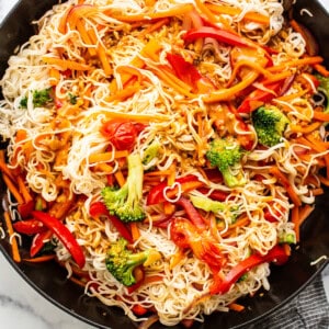 A skillet filled with noodles and vegetables.