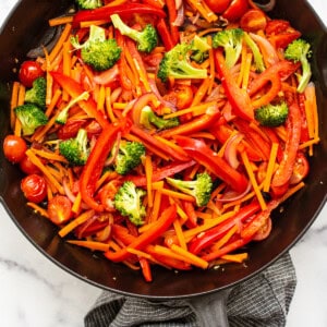 cooking veggies in skillet.