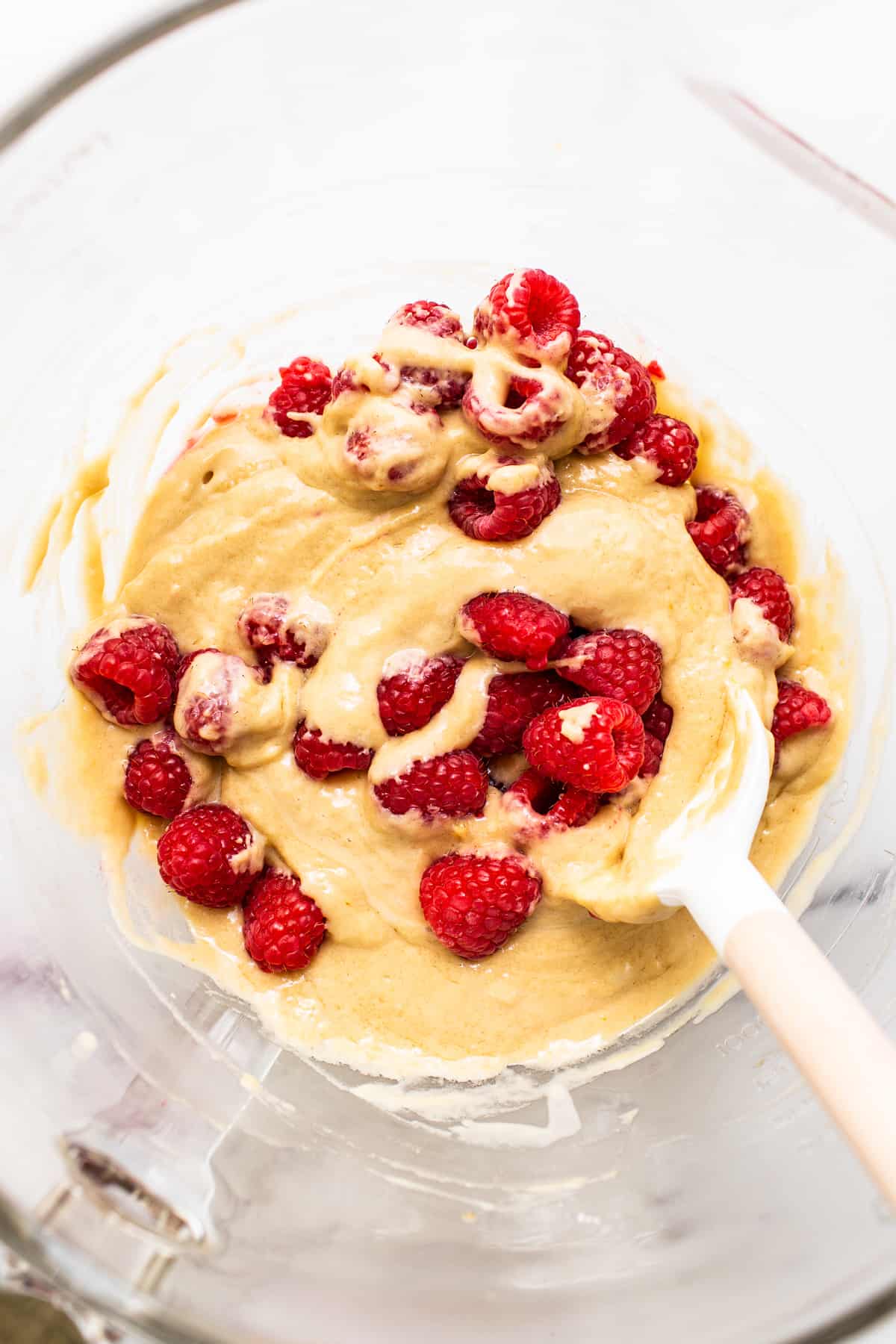 raspberry muffin batter in bowl.