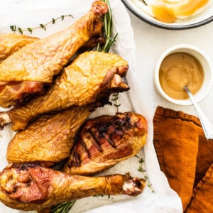 Smoked turkey legs on a platter.