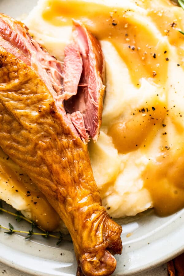 Smoked turkey leg in mashed potatoes.