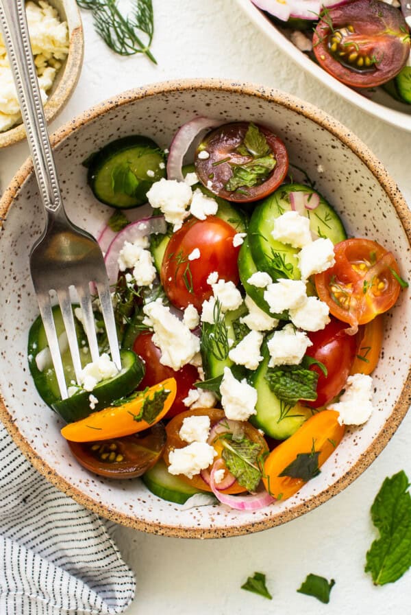 Cucumber tomato salad in a bowl.