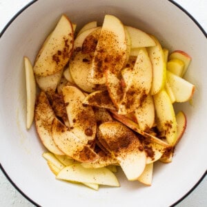 Apples and spices in a bowl.