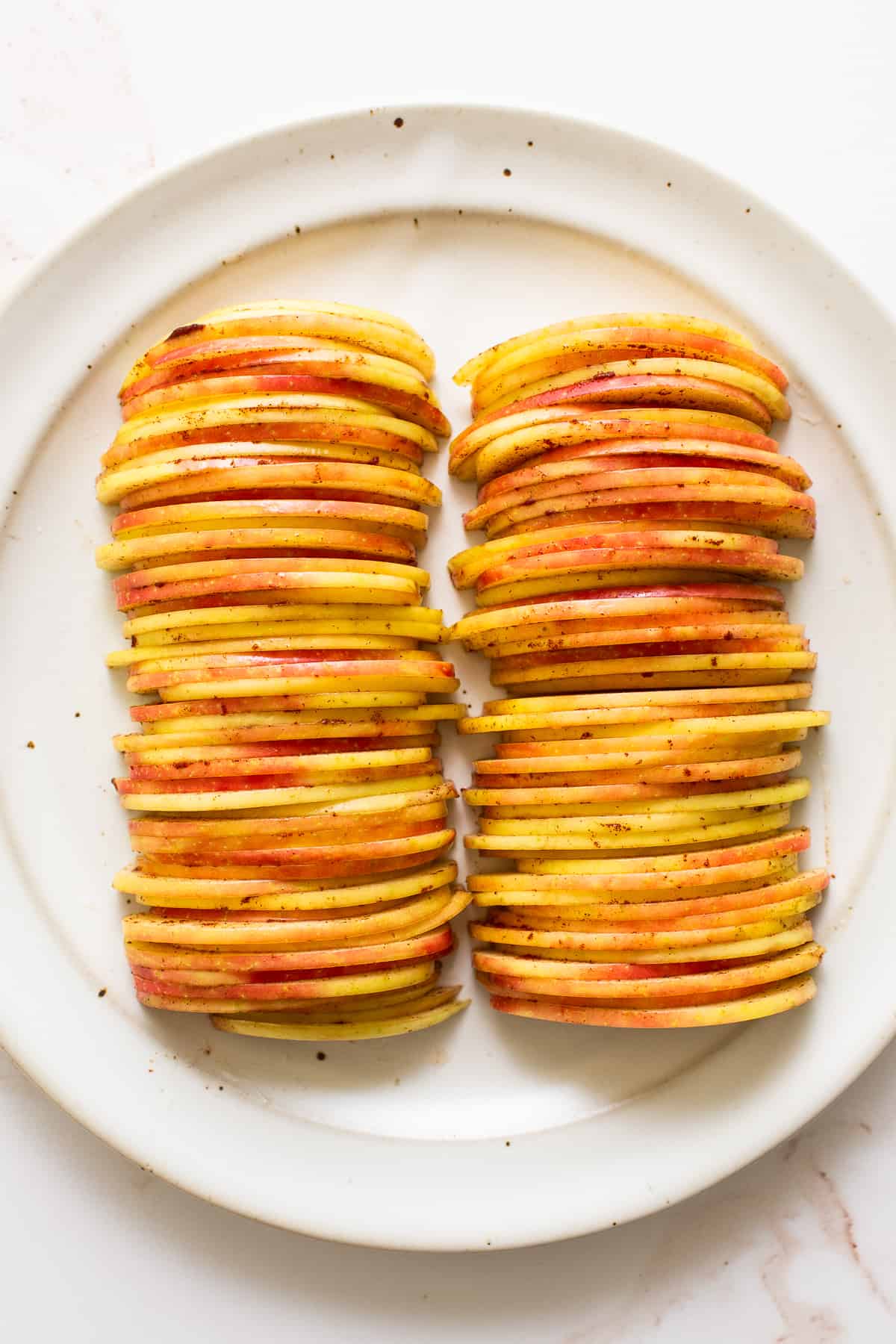 Sliced apples on a plate.