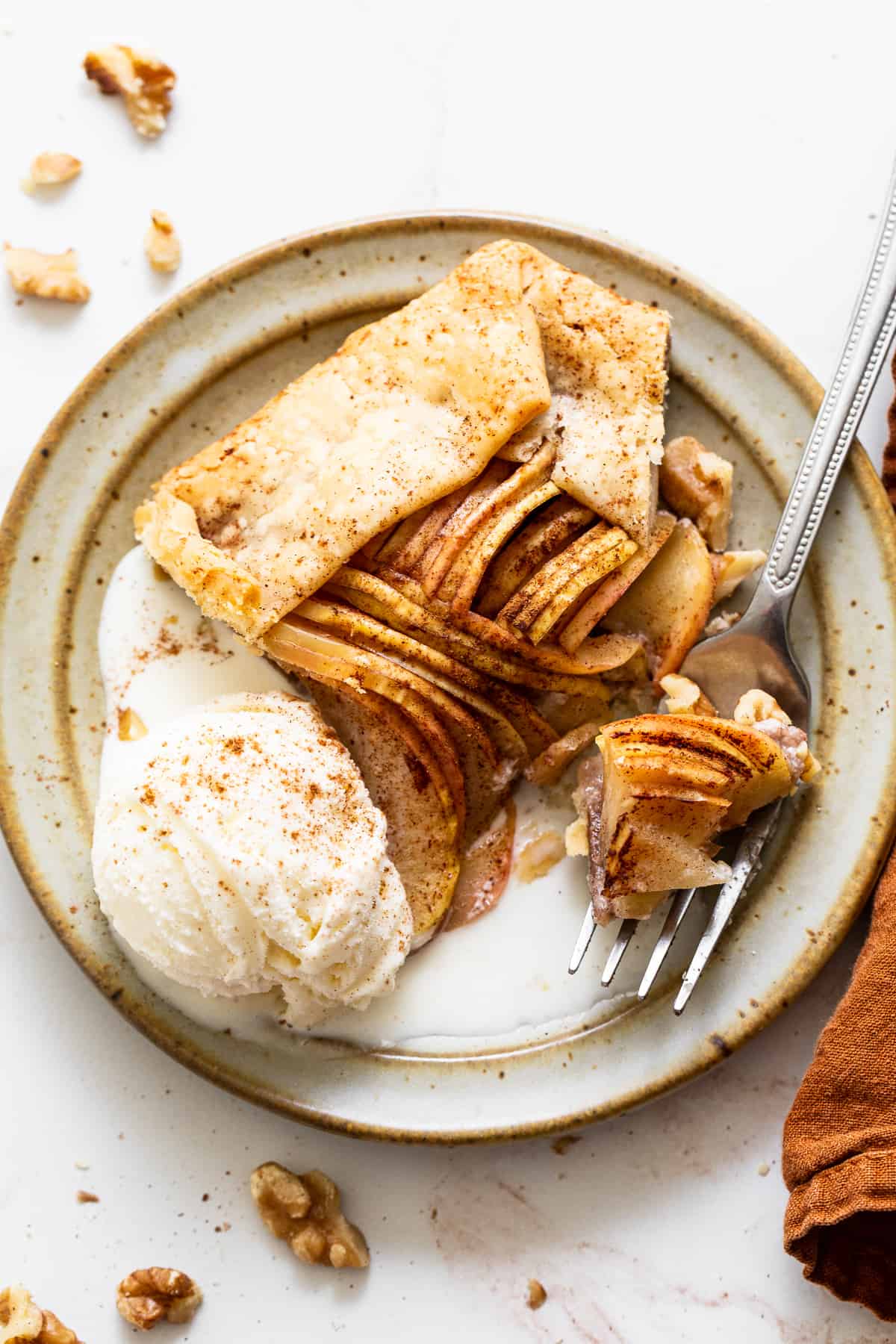 Sliced apple galette on plate.