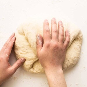 kneading pizza dough.