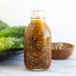 Italian dressing in glass bottle.