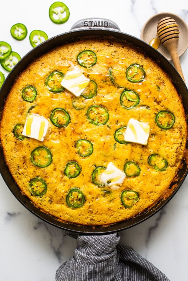 Jalapeno corn pudding in a cast iron skillet.