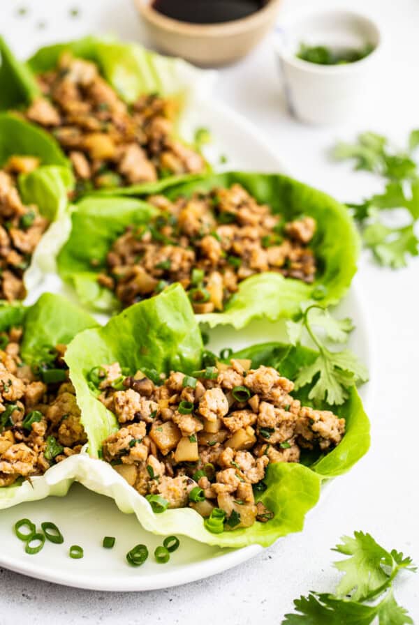 chicken lettuce wraps on platter.