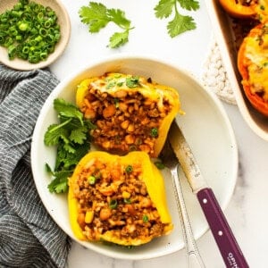 Mexican stuffed peppers on a white plate.