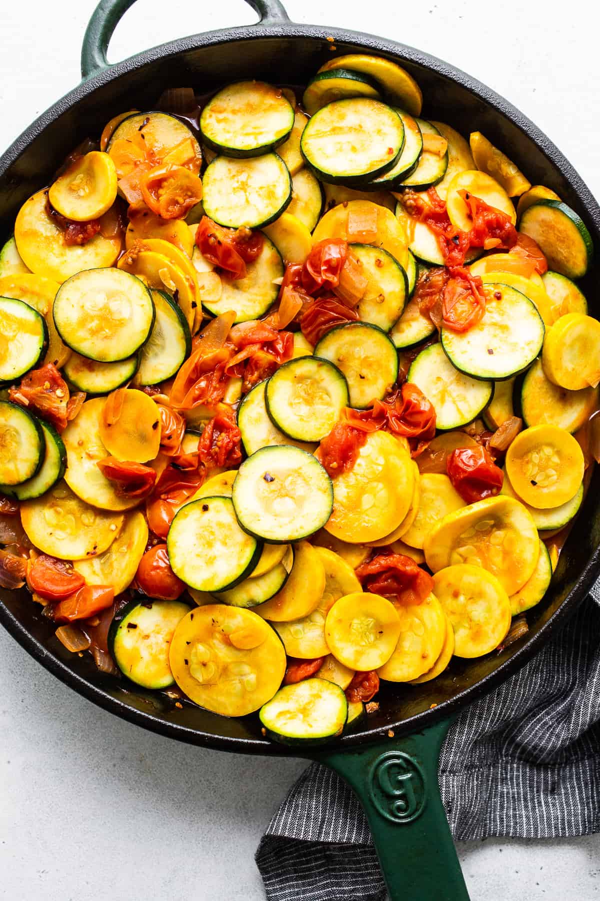 Zucchini and yellow squash in a skillet.