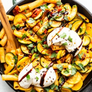 Summer squash pasta in a cast iron pan.