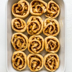 Apple cinnamon rolls in a baking dish.