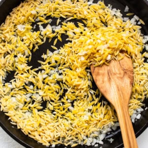 toasting orzo in skillet.