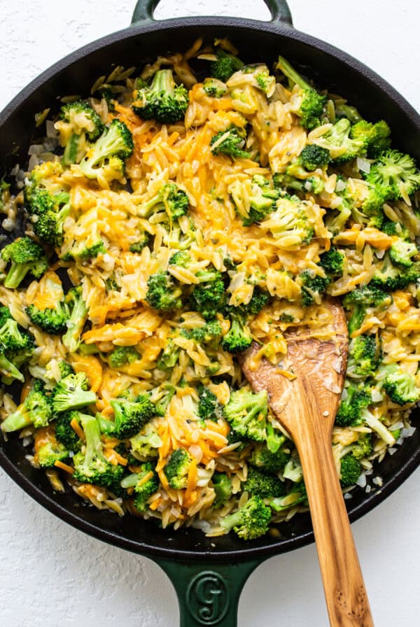 broccoli and cheese casserole in cast iron skillet.