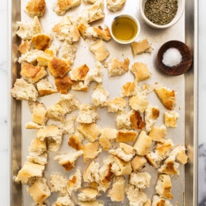 ripped bread on baking sheet.