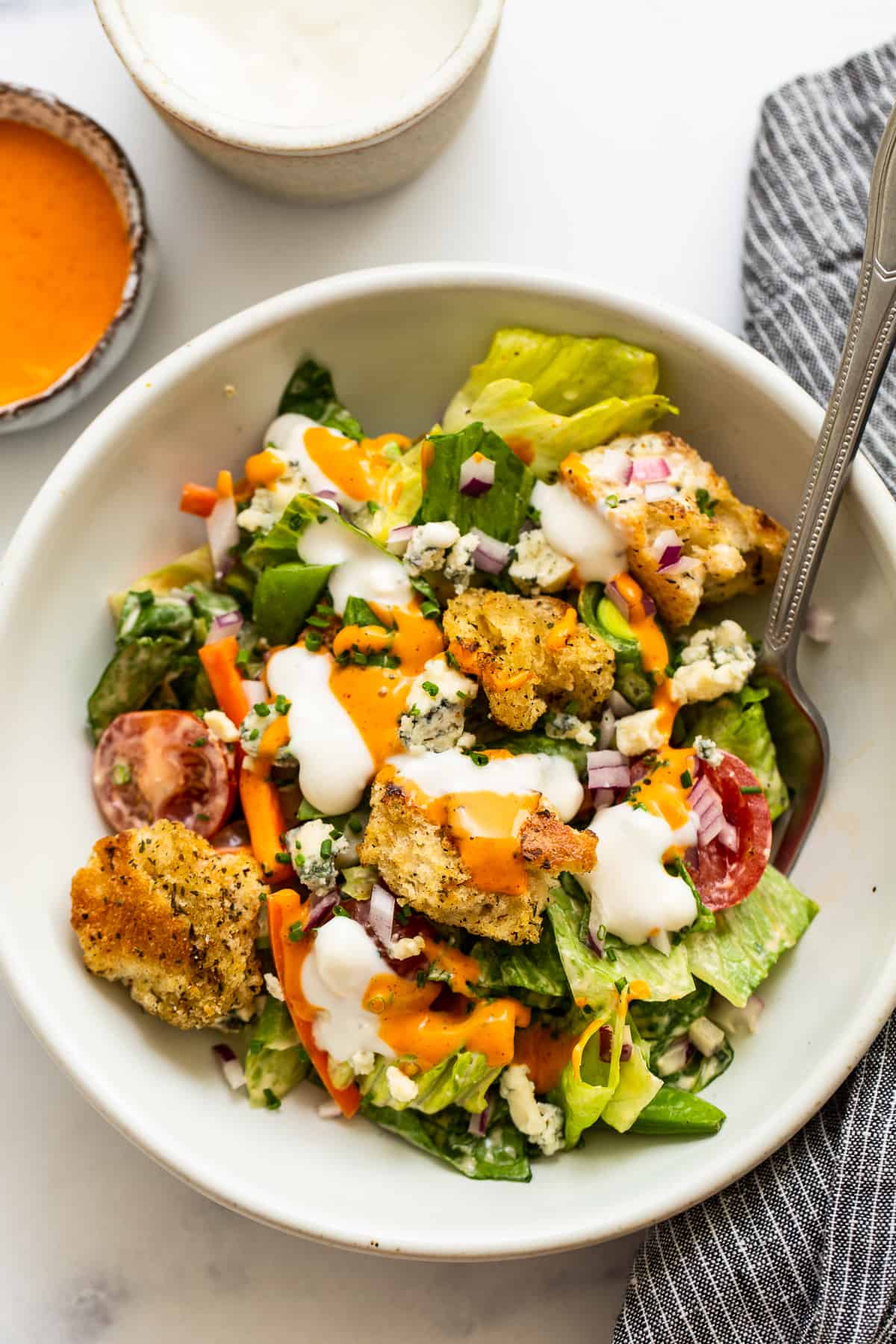 Garden salad in a bowl with a fork.