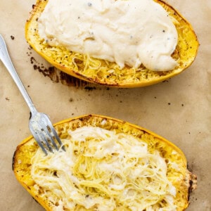 Two squash boats with a fork on top.