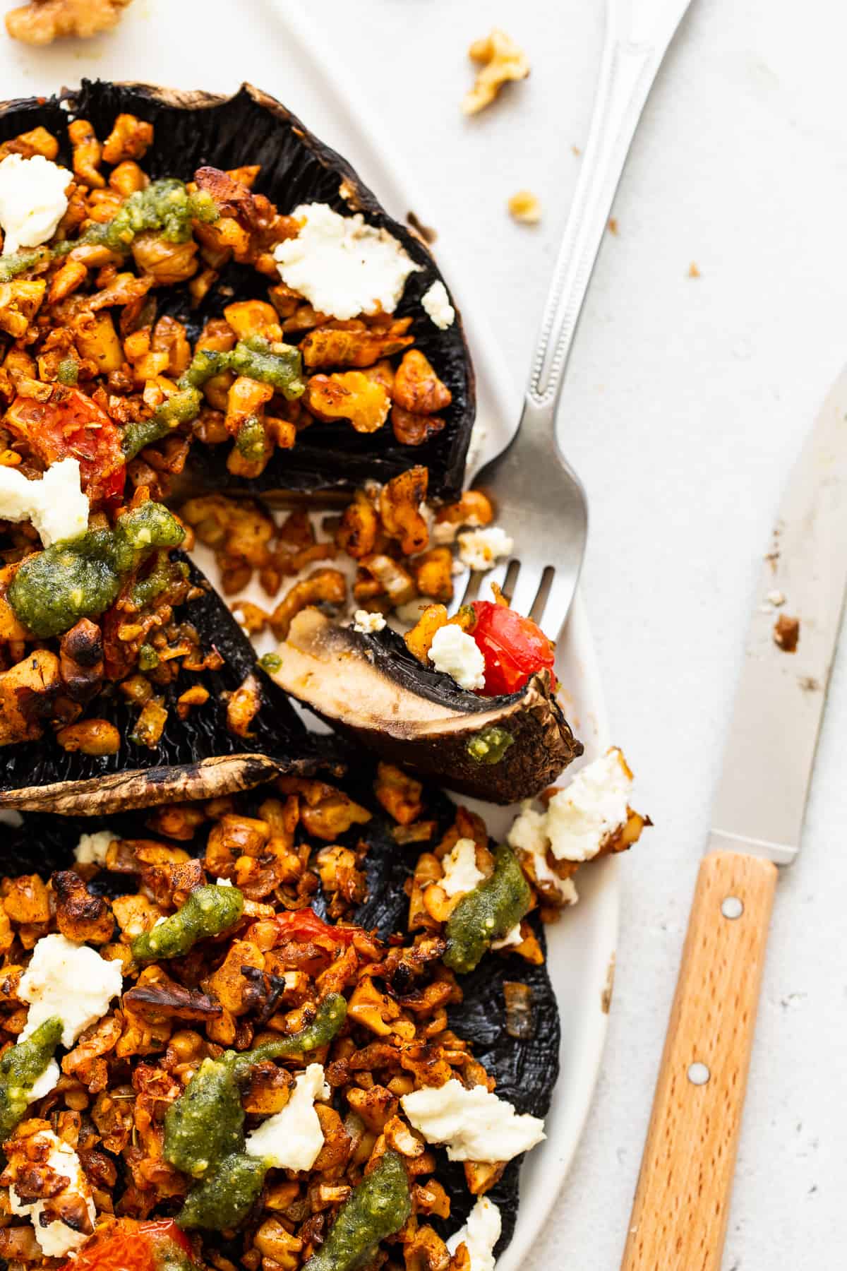 A bit of a stuffed portobello mushroom on a fork.