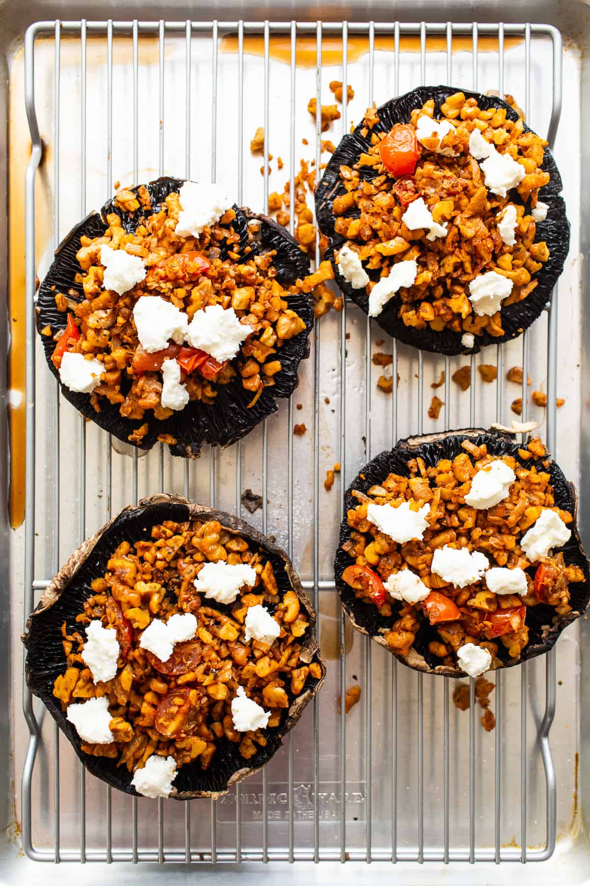 Stuffed portobello mushrooms with goat cheese on top.