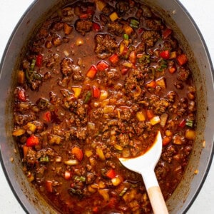 Texas chili simmering in a pot.