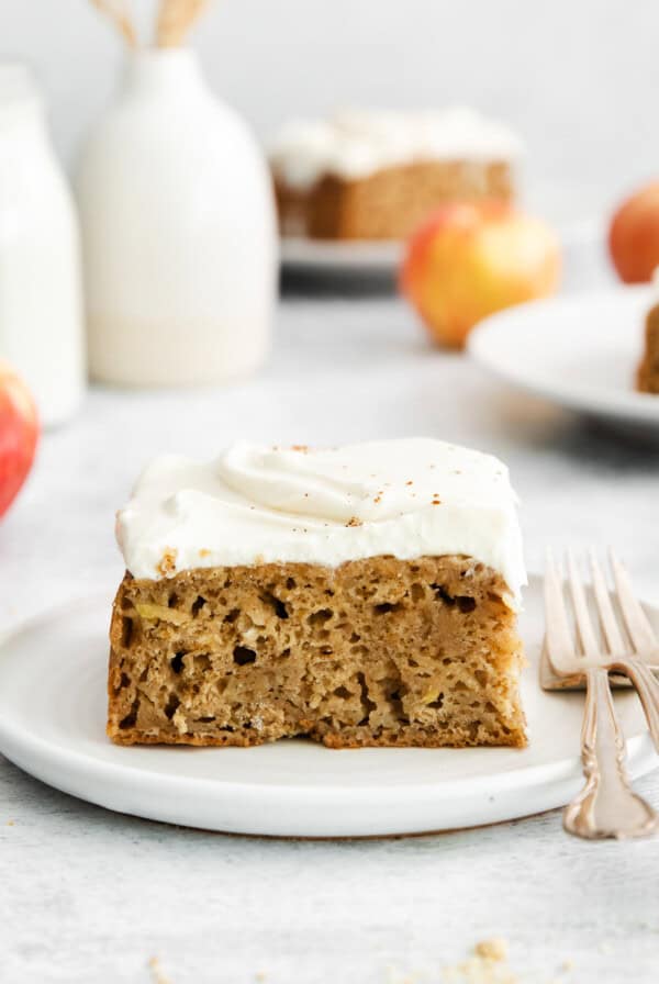 A piece of apple cake on a plate.