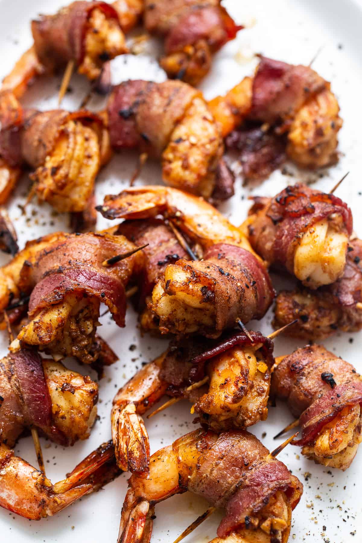 Bacon wrapped shrimp on a serving platter.